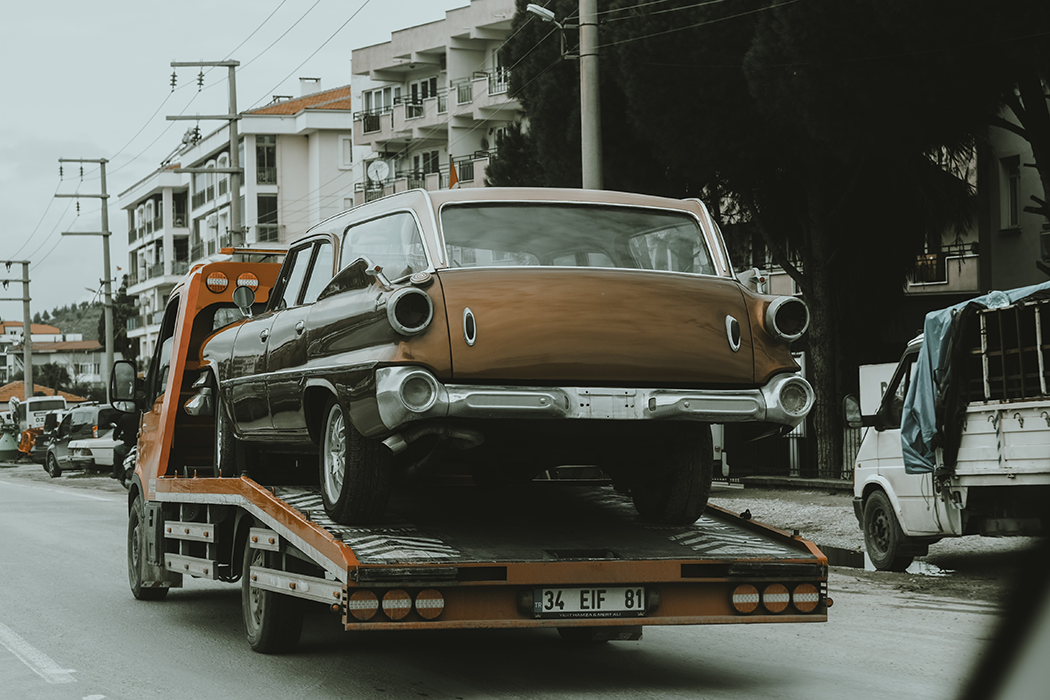 Car on flatbed tow truck