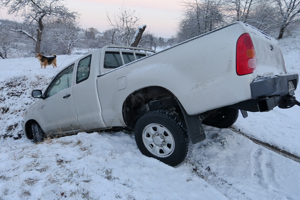 truck that has slid into a ditch due to snow