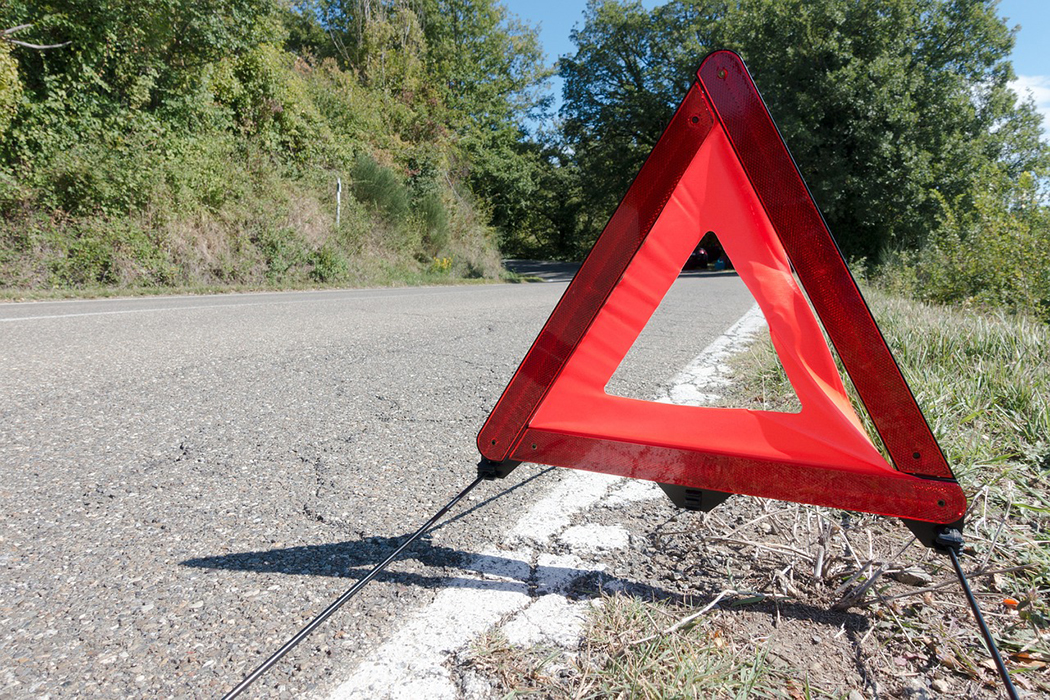 hazard sign on the side of the road