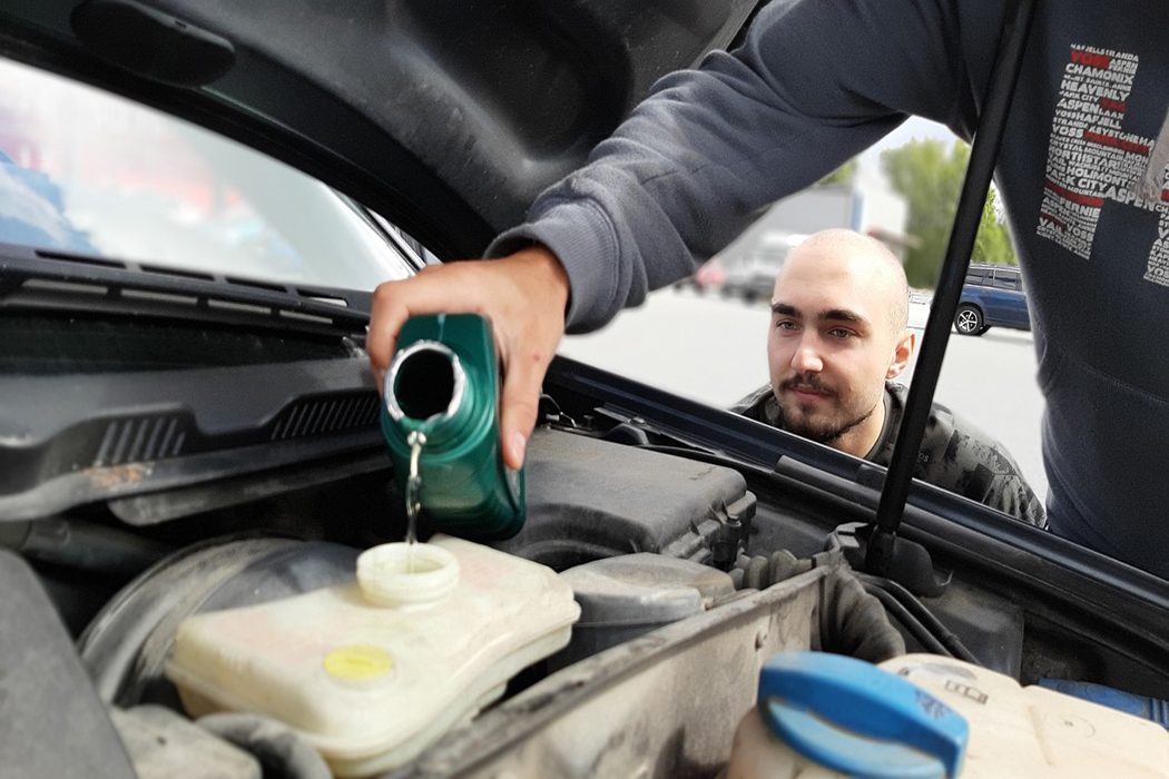 adding coolant to car